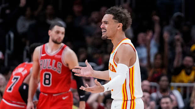 Trae Young questions a referee's call.